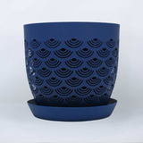 Blue BREATHE planter with black geometric pattern on a white background