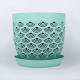Mint BREATHE planter with black geometric pattern on a white background