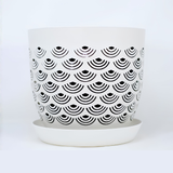 White BREATHE planter with black geometric pattern on a white background